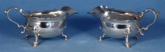 A pair of George II silver sauce boats, attributed to Joseph Sanders, length 195mm, weight 24.4 oz/760grms.